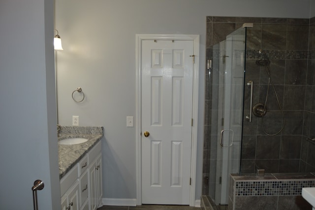 bathroom with vanity and walk in shower