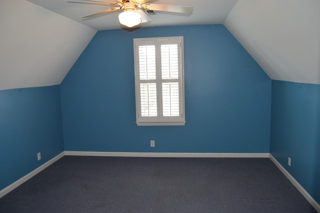 additional living space featuring lofted ceiling, ceiling fan, and carpet flooring