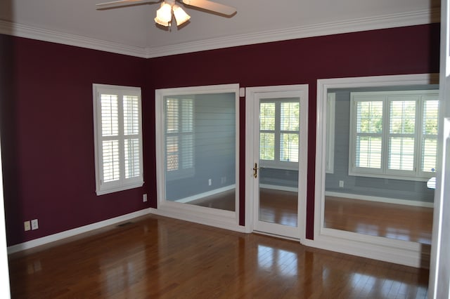 doorway to outside featuring ornamental molding, ceiling fan, and dark hardwood / wood-style floors