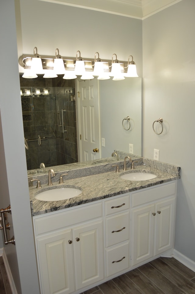 bathroom featuring vanity, hardwood / wood-style flooring, and an enclosed shower