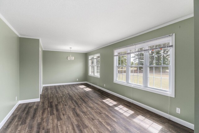 spare room with dark hardwood / wood-style floors and crown molding