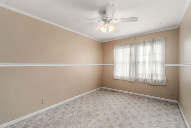 unfurnished room featuring ceiling fan, light carpet, and crown molding