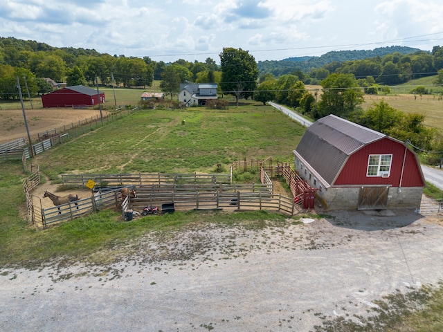 birds eye view of property featuring a rural view