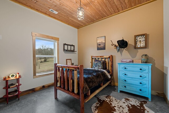 bedroom with wood ceiling and concrete floors