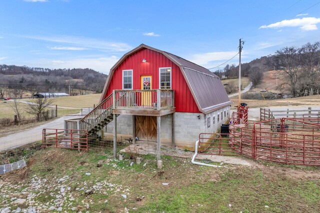 view of outdoor structure with a rural view and central AC