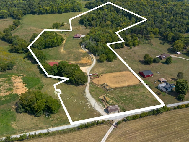 birds eye view of property with a rural view