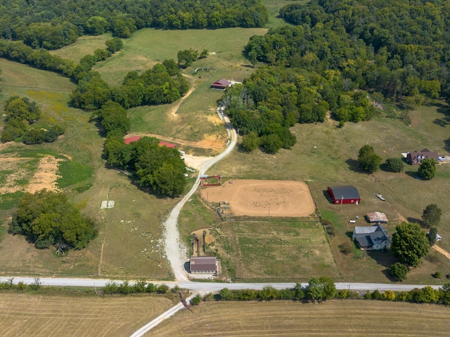 birds eye view of property with a rural view