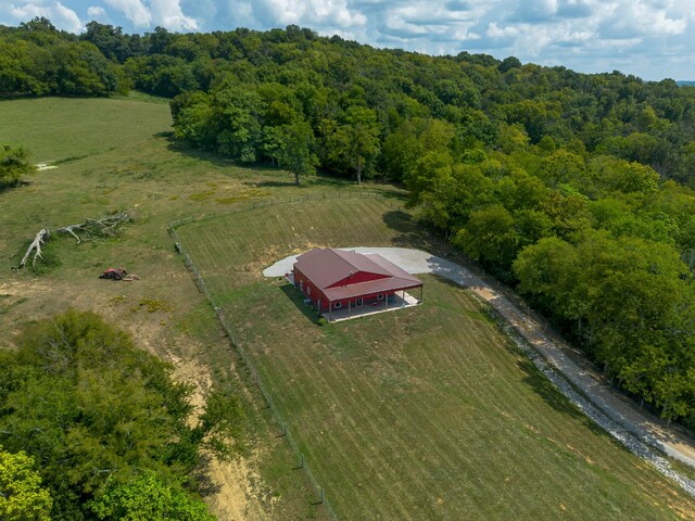 birds eye view of property with a rural view