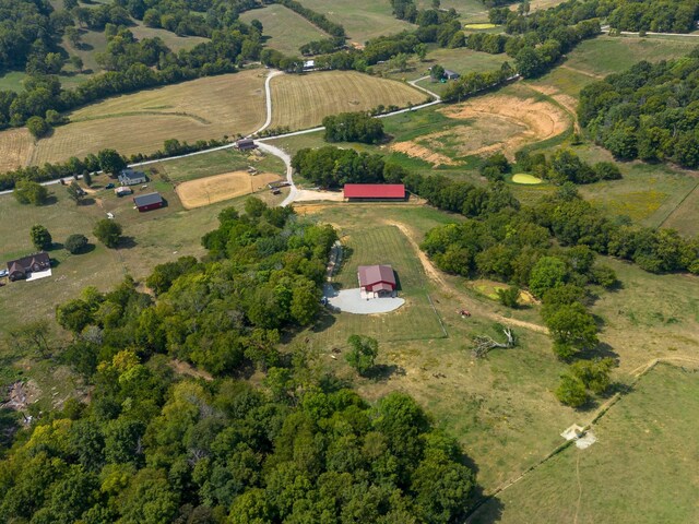 birds eye view of property with a rural view