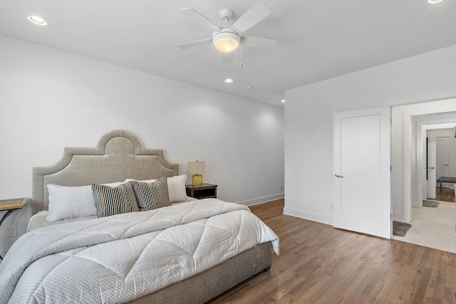 bedroom featuring ceiling fan and wood-type flooring