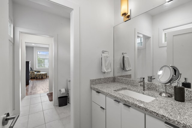 bathroom with hardwood / wood-style floors and vanity