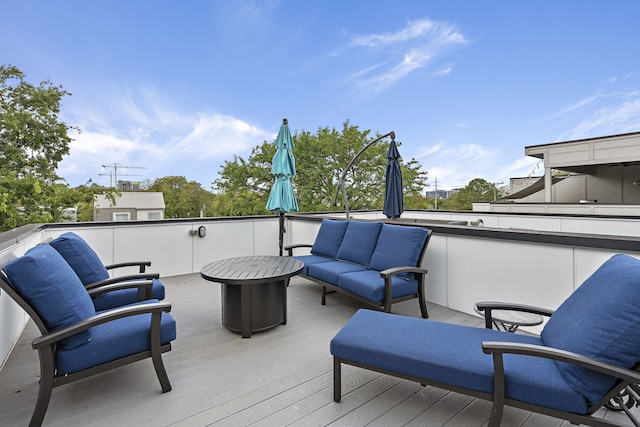 wooden deck with an outdoor hangout area