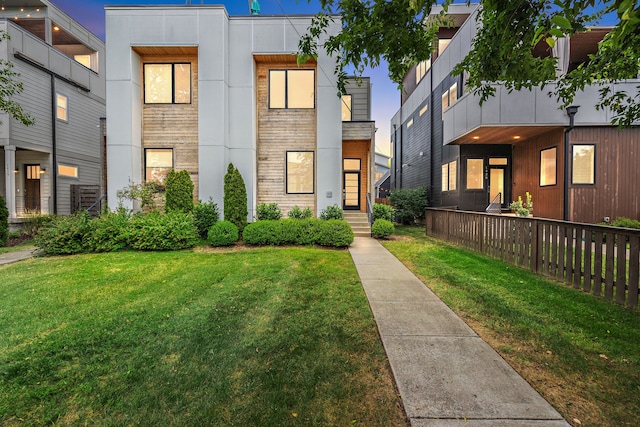 modern home with a front lawn