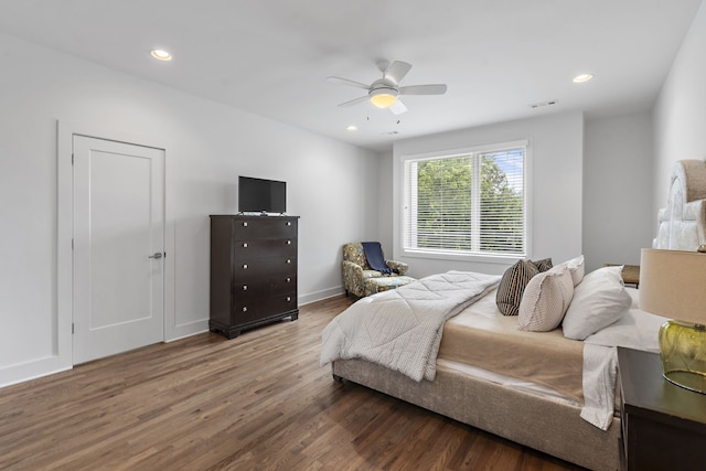 bedroom with ceiling fan and wood-type flooring