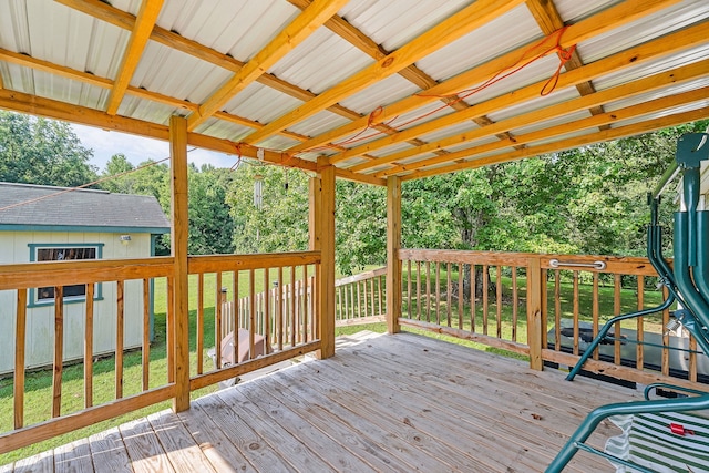 wooden deck with a lawn