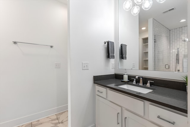 bathroom featuring vanity and a tile shower