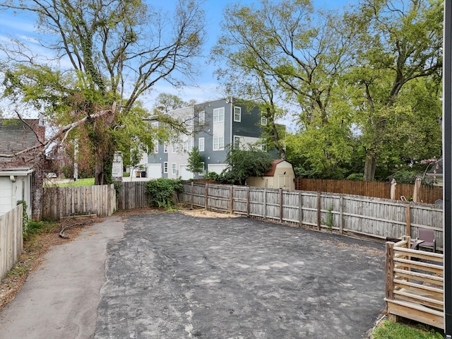 view of patio with a storage shed