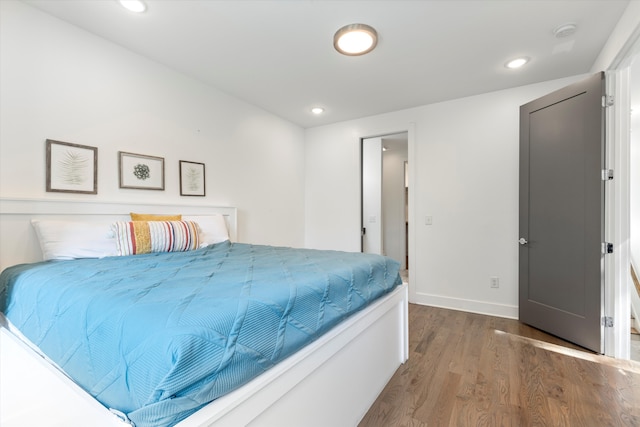 bedroom featuring dark hardwood / wood-style flooring