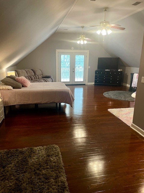 bedroom featuring vaulted ceiling, dark hardwood / wood-style flooring, access to exterior, and ceiling fan