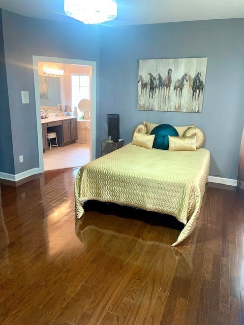 bedroom with wood-type flooring