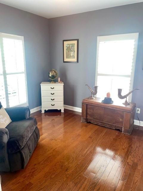 office area with baseboards and wood finished floors