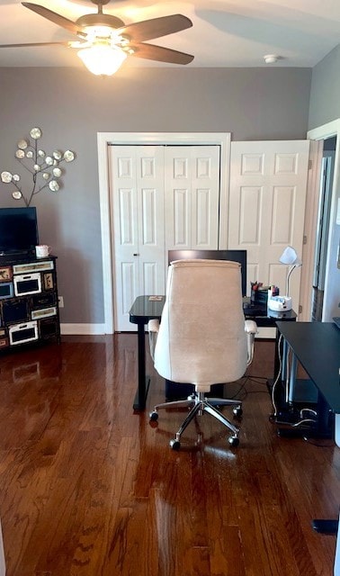 office featuring dark wood-type flooring and ceiling fan