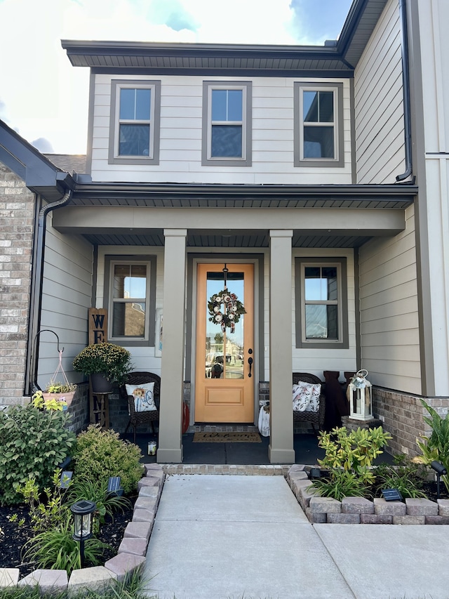 doorway to property with covered porch