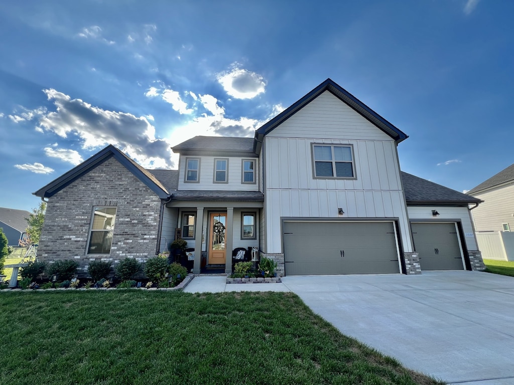 view of front of home with a garage and a front yard