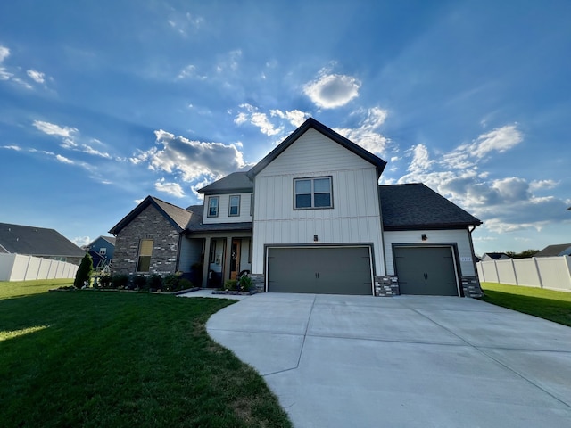 view of front facade with a front yard and a garage