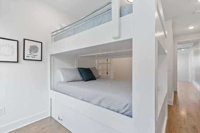 bedroom with light hardwood / wood-style flooring