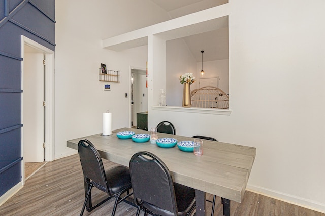 dining space with hardwood / wood-style flooring