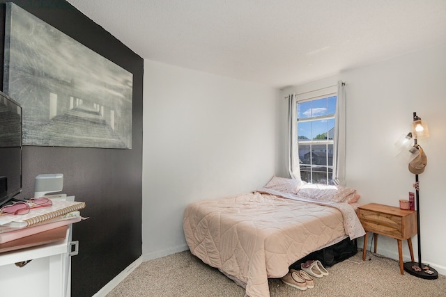 bedroom with light colored carpet