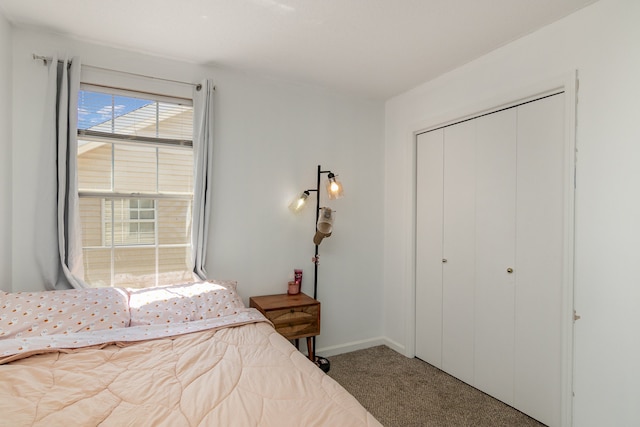 carpeted bedroom featuring a closet