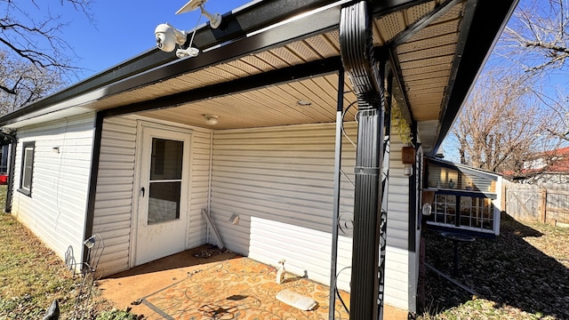 view of side of property featuring a patio area