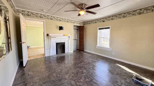 unfurnished living room featuring ceiling fan and a fireplace