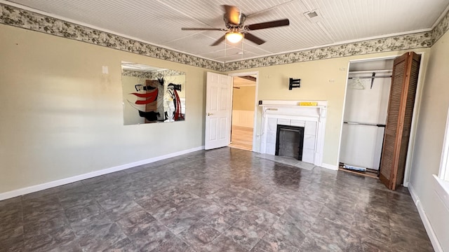 unfurnished living room featuring ceiling fan and a tile fireplace