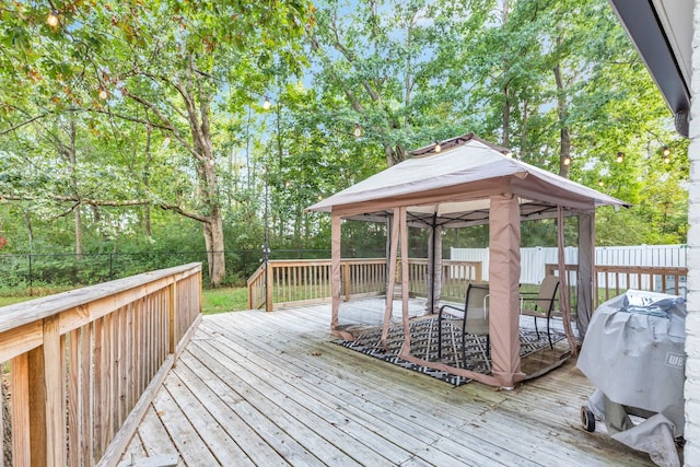 wooden deck featuring a gazebo