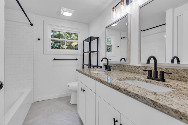 full bathroom with vanity, toilet, and tiled shower / bath