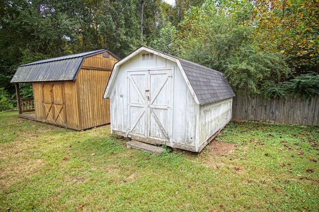 view of outbuilding with a lawn