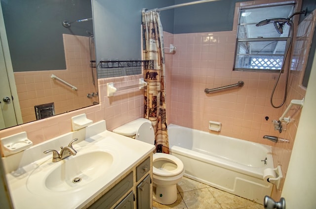 full bathroom with vanity, tile walls, toilet, decorative backsplash, and shower / bath combo