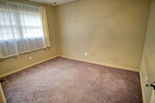 empty room with carpet flooring