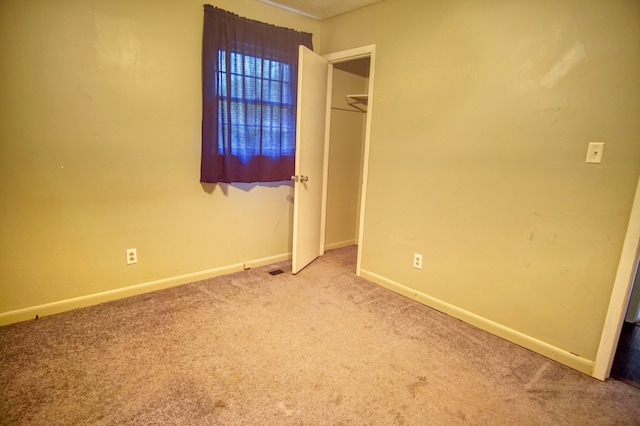 unfurnished bedroom featuring carpet