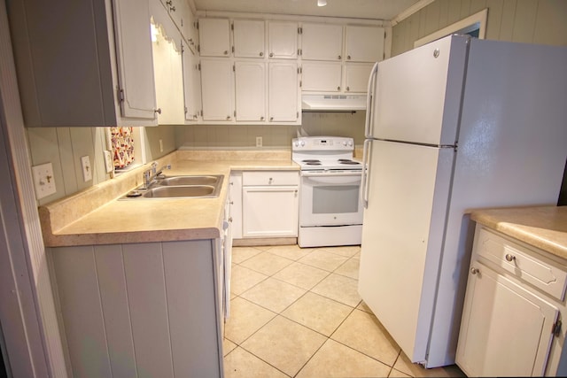 kitchen with white appliances, light tile patterned flooring, sink, and white cabinets