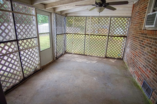 unfurnished sunroom with ceiling fan