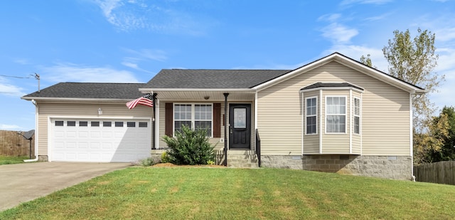 view of front of home featuring a front yard and a garage