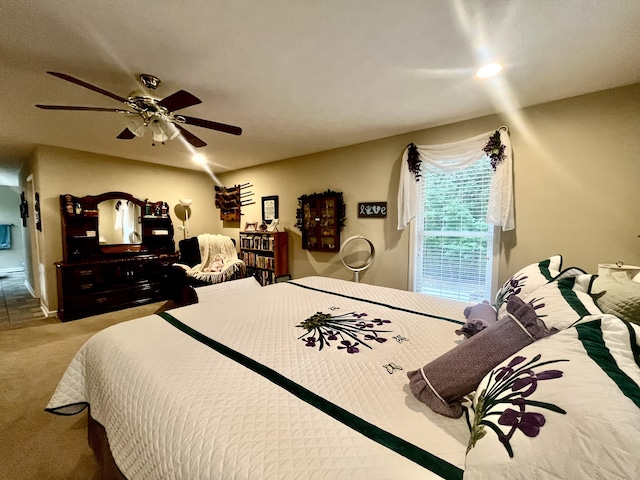 carpeted bedroom featuring ceiling fan