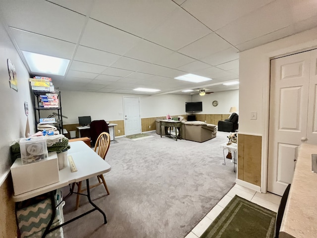 tiled home office featuring a drop ceiling