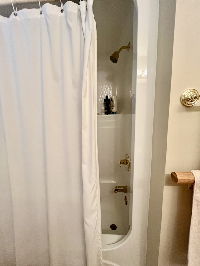 bathroom with a shower with curtain