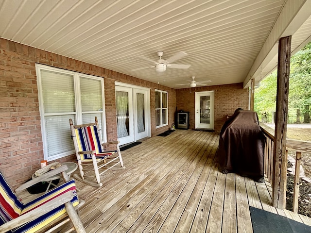 wooden terrace featuring ceiling fan