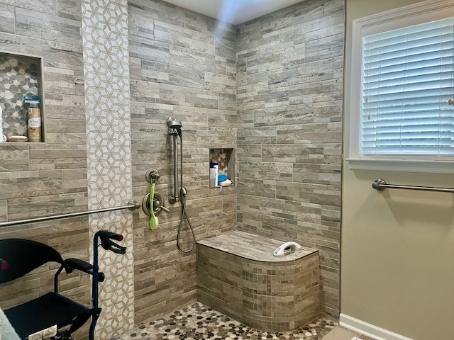 bathroom featuring tiled shower